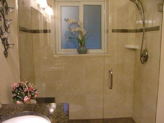 Frameless shower door with in-line panel