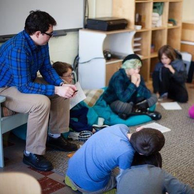 Upper Elementary students sharing in a group discussion.