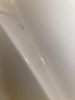 Soap scum in bathroom tub