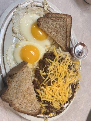 Chili hash brown and cheese with 2 eggs and whole wheat toast.