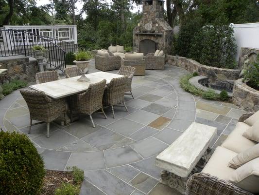 Outdoor Entertaining Area with Fireplace, Water Feature and Dining Area