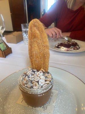 Chocolate mouse with hazelnuts on top and a yummy cookie