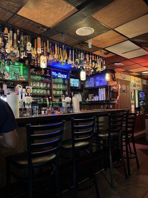 Part of the bar with named mugs