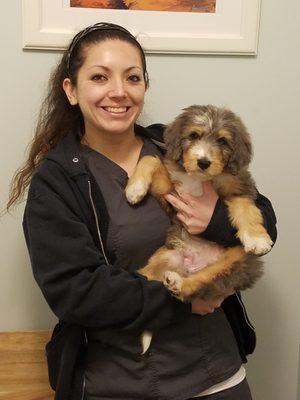 Janelle cuddles a new puppy, starting out right for our first visit.