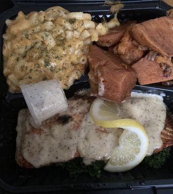 Salmon with creamy garlic sauce, macaroni and cheese, candied yams