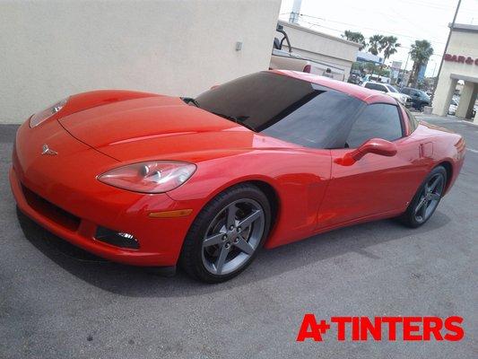 Luxury Red Corvette with tint installation.