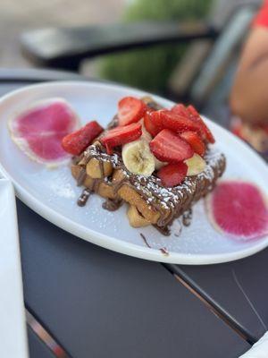 Nutella waffles with strawberry and bananas.