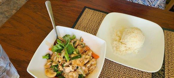 Garlic chicken with a scoop of white rice. Wife took half home for lunch tomorrow.