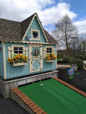 Several holes feature these cute little houses.