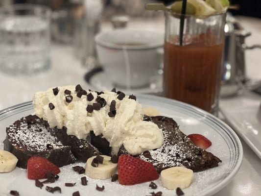 Chocolate Sourdough French Toast with bananas, strawberries and whipped cream