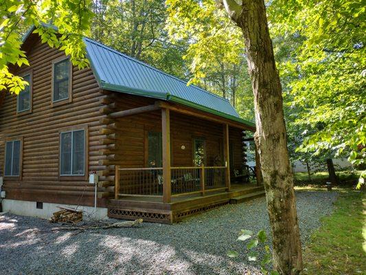 New Master Rib Metal Roof and 6" gutter system on beautiful log cabin home.