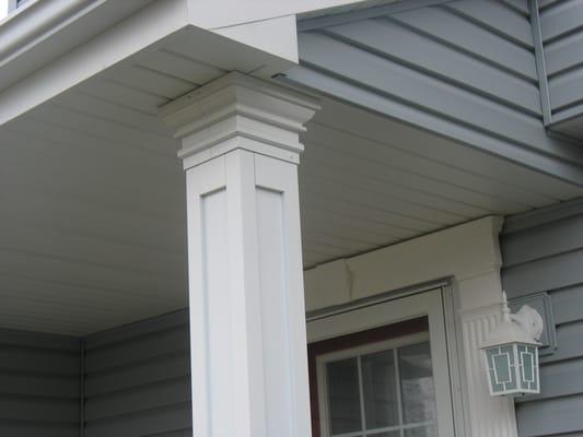 Custom Aluminum column Mastic vinyl door surround and mastic vinyl window mantels made this project a beautiful home .