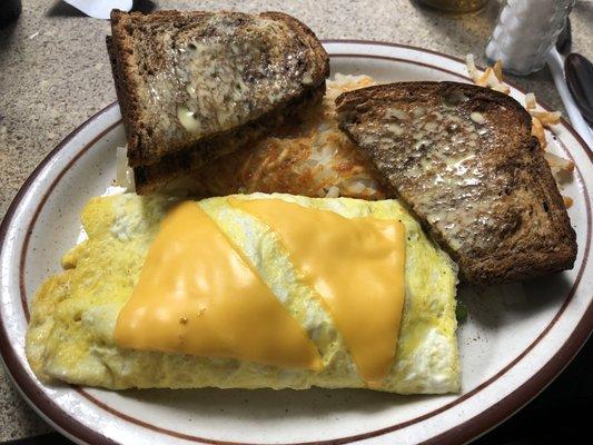 A Country Omelet with whole wheat and a mountain of hash browns.