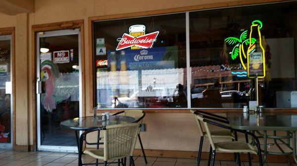 Storefront with covered patio in foreground.