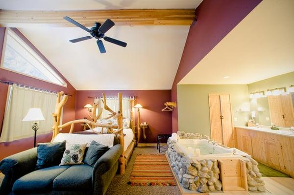 Each suite is complete with 2 person Jacuzzi spa, river rock fireplace and hand crafted pine log beds.