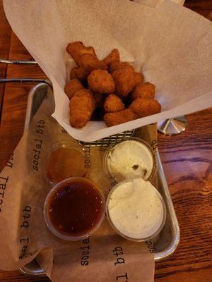 Fried cheese curds with ranch and mango habanero sauces