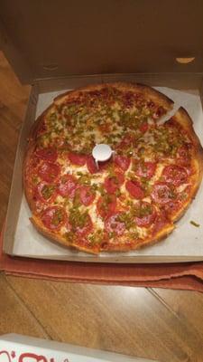 Large pizza with half pepperoni and full green peppers ... Delicious