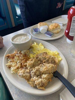 Chicken Fried Chicken Breakfast with Golden Hash Browns and biscuits