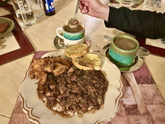 Red beans & Rice topped with fried chicken and cups of gumbo.