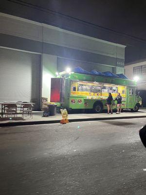 The taco truck is located on a small street