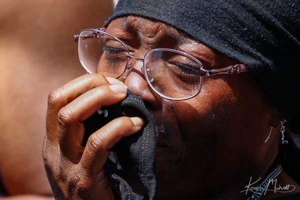 Elijah McClain's mother, Sheneen McClain, weeps at a protest calling for justice for her son. Photo by Kevin Mohatt