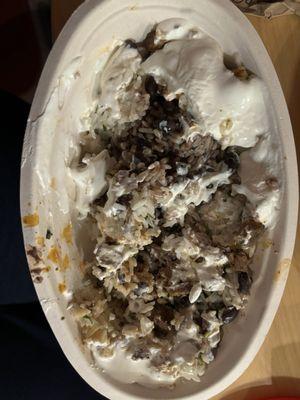 Steak burrito bowl with no color, no flavor no cheese and way too much sour cream