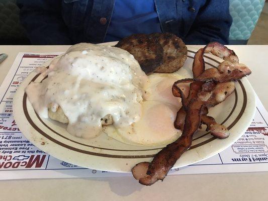 Biscuits and gravy with sausage with eggs and bacon