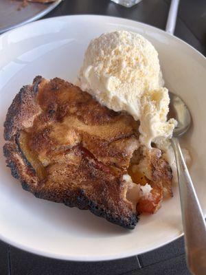 Fresh peach cobbler and ice cream.