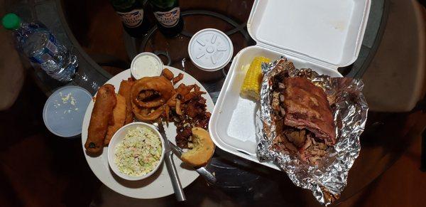 Side of slaw with a small portion of the Family Platter appetizer. On the right is the Jake's Super BBQ Sampler.