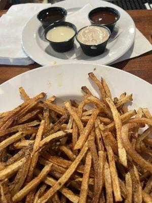 Flight of fries and sauces.