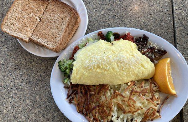 Mediterranean Vegetable Omelette with Hash Browns and Wheat Toast