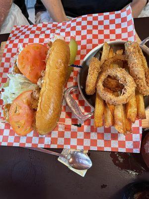 Poor boy with onion rings and fries