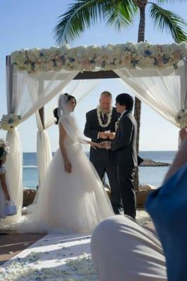 Veil - Julian Gold | Gown - Christos, Brisa | Venue - Disney Aulani | Floral - Yvonne Design | Adjustable Headband - Dauphines of New York