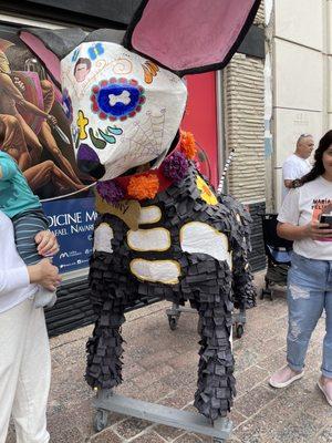 Big papier-mâché dog in Viva La Vida parade