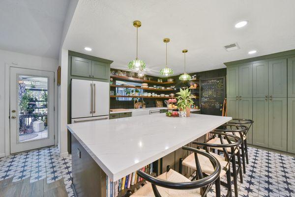 Kitchen Remodeling
 Marble Island & Green Cabinets: Replaced the old white kitchen with a striking marble island and elegant green cabinets.