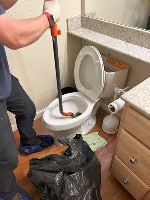 Clearing a client's blocked toilet