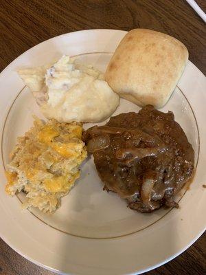 Hamburger steak mashed potatoes hash brown casserole roll.