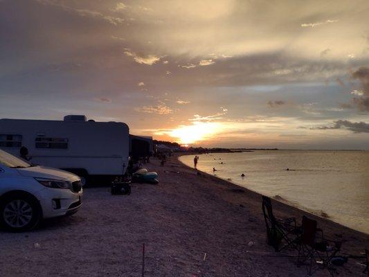 Sunset, campers, oyster bed shoreline