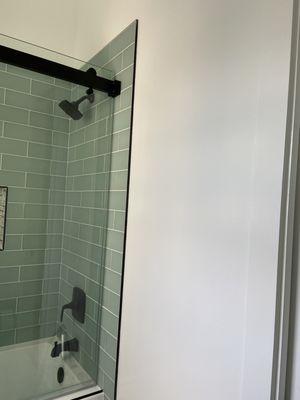 shower head and beautiful tile in shower