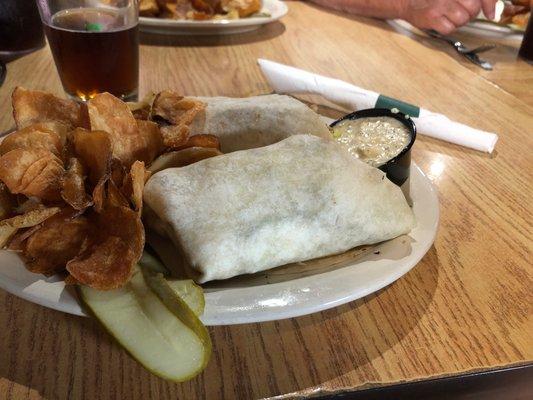 Chicken wrap, fries and dill sauce on the side