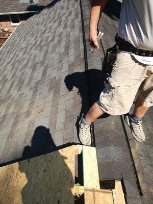 Extending the roof out over the new screened in veranda we built