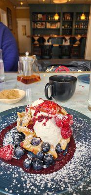 Waffles with Fresh berries and whipped cream.