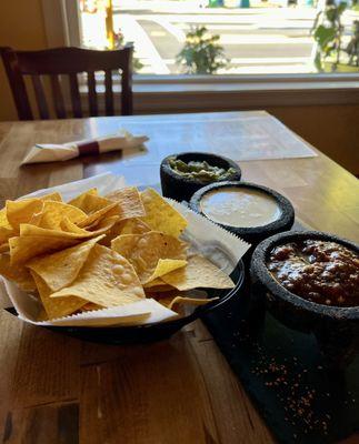 Chips with salsa queso and guacamole