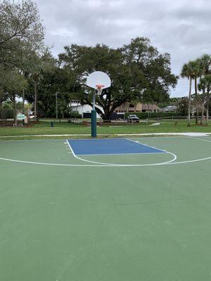 New paved basketball court.