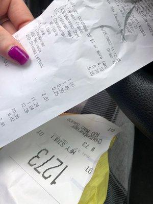 A receipt and a messed up burger