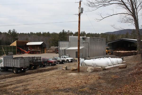 A photo from behind the kiln in our wood yard.