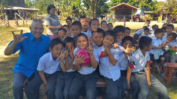 Attorney Milam went on a mission trip to Laos. This soccer team had no shoes or uniforms. The Milams felt called to bless the boys.