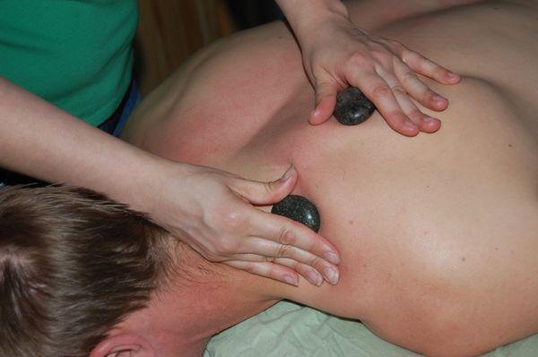 The heat from Hot stones can help relax deeper muscle tissue.