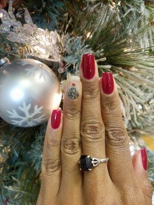 "Oh Christmas Tree Oh Christmas Tree" Red color gel nails with an inverted gel Christmas tree design.