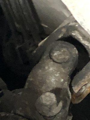 Pictures of a screw that was a half inch from coming out the steering That this company removed And did not put in back in